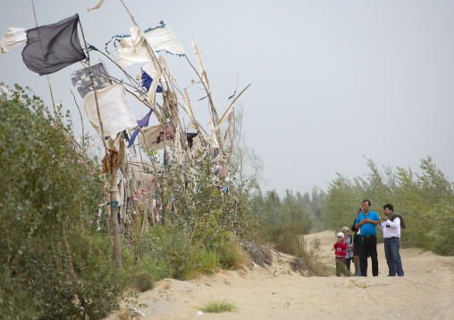 Uyghur Family At Imam Asim Tomb In The Taklamakan Desert, Xinjiang Uyghur Autonomous Region, China
