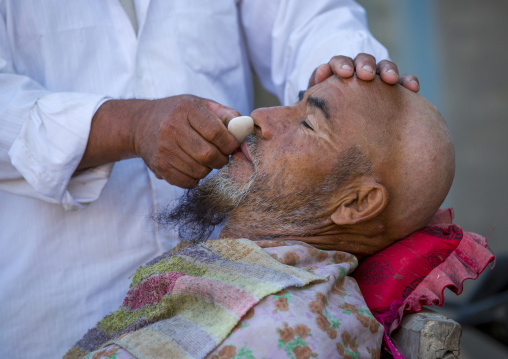 Uyghur Man Getting Shaved By A Barber At Serik Buya Market, Yarkand, Xinjiang Uyghur Autonomous Region, China