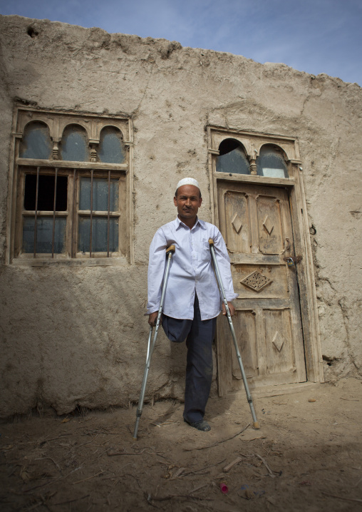 Uyghur Cotton Producer In Front Of A House, Hotan, Xinjiang Uyghur Autonomous Region, China