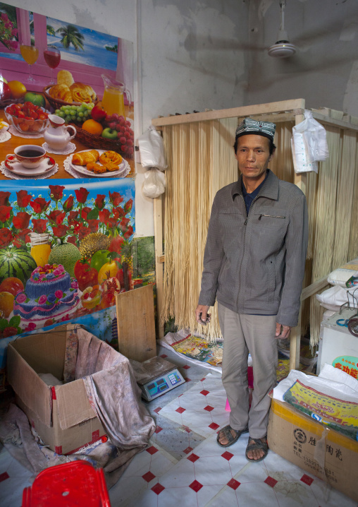 Drying Laghman In A Shop And Uyghur Shopkeeper, Minfeng, Xinjiang Uyghur Autonomous Region, China