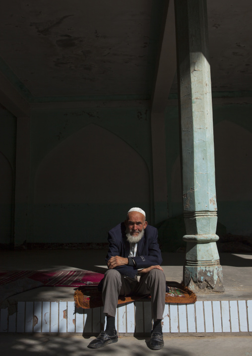 Old Uyghur Man Resting Outside The Mosque, Yarkand, Xinjiang Uyghur Autonomous Region, China