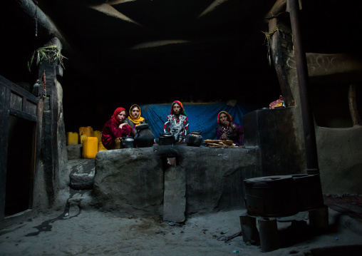 Afghan family inside their traditional pamiri house, Badakhshan province, Khandood, Afghanistan