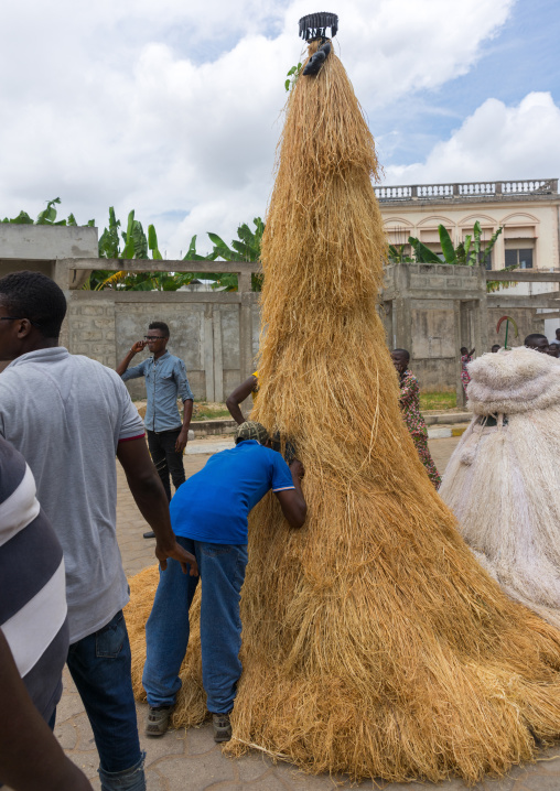 Benin, West Africa, Porto-Novo, man speaking to a zangbetos guardians of the night spirit