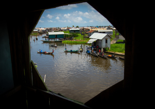 Benin, West Africa, Ganvié, boats queueing to collect fresh water on lake nokoue
