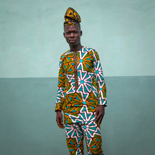 Benin, West Africa, Ganvié, fashionable young man in traditional beninese clothing