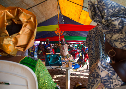 Benin, West Africa, Ganvié, traditional dancer during a ceremony in front of rich people