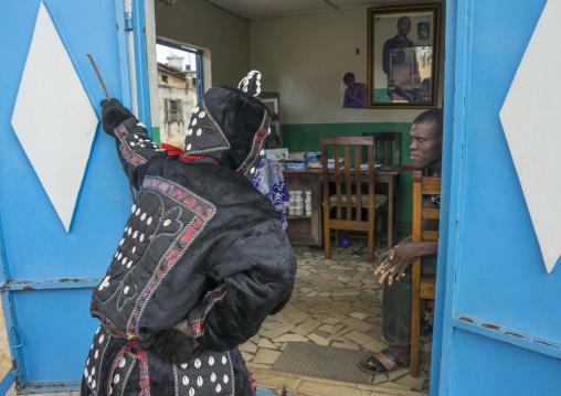 Benin, West Africa, Porto-Novo, egoun egoun spirit of the deads asks money to people in exchange of blessings