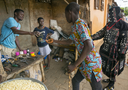 Benin, West Africa, Porto-Novo, egoun egoun spirit of the deads asks money to people in exchange of blessings