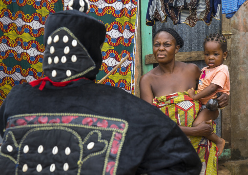 Benin, West Africa, Porto-Novo, egoun egoun spirit of the deads asks money to a mother in exchange of blessings