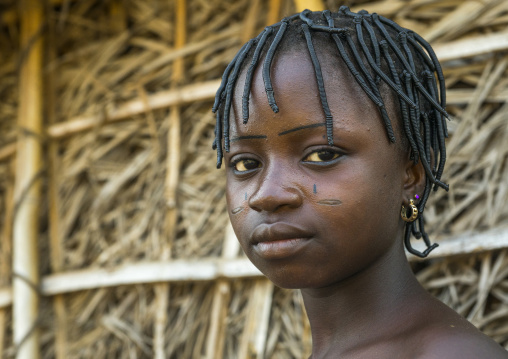 Benin, West Africa, Onigbolo Isaba, holi tribe girl with traditional facial tattoos and scars