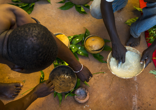 Benin, West Africa, Bonhicon, kagbanon bebe voodoo priest during a ceremony drawing white spots on a pot