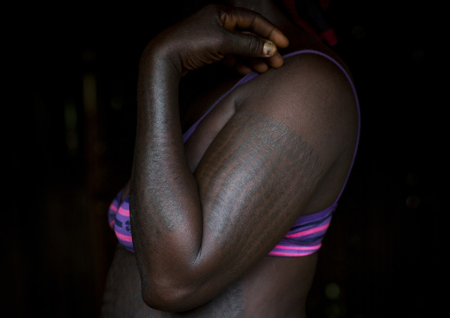 Benin, West Africa, Onigbolo Isaba, holi tribe woman covered with traditional tattoos and scars