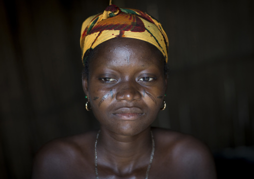 Benin, West Africa, Onigbolo Isaba, holi tribe woman covered with traditional facial tattoos and scars