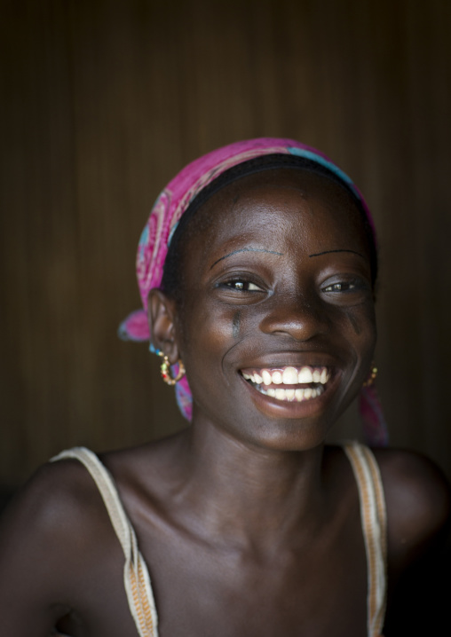 Benin, West Africa, Onigbolo Isaba, holi tribe girl covered with traditional facial tattoos and scars