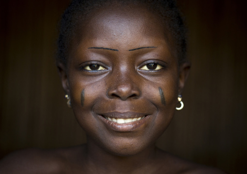 Benin, West Africa, Onigbolo Isaba, holi tribe girl with traditional facial tattoos and scars