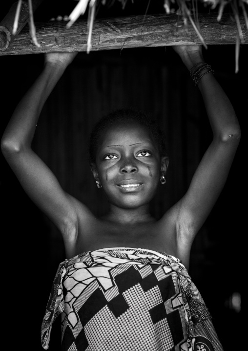 Benin, West Africa, Onigbolo Isaba, holi tribe girl with traditional facial tattoos and scars