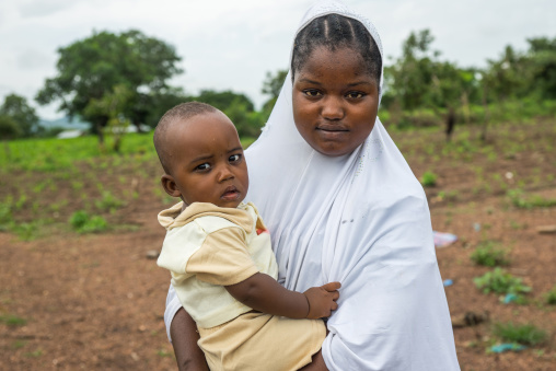Benin, West Africa, Taneka-Koko, a peul tribe young mother with her baby