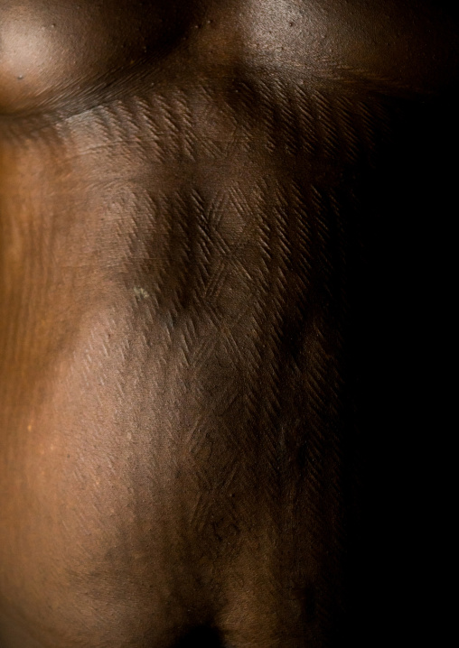 Benin, West Africa, Koussou, a somba tribe man belly covered with linear scars