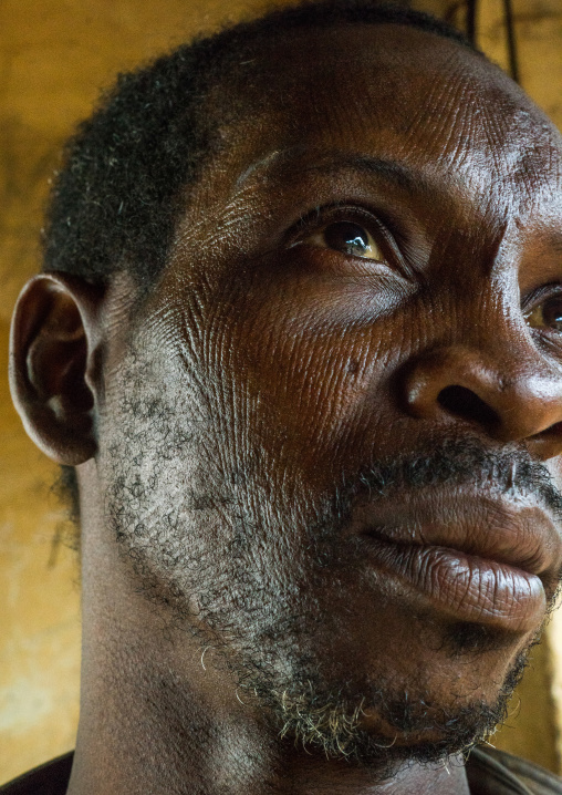 Benin, West Africa, Koussou, a somba tribe man with his face covered with linear scars