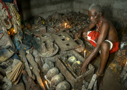Benin, West Africa, Bopa, dah tofa voodoo master showing the skulls criminals killed by heviosso the god of thunder that he collects