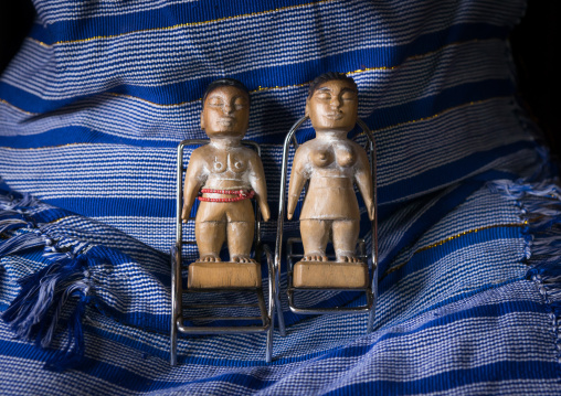 Benin, West Africa, Bopa, miss hounyoga with the carved wooden figures made to house the soul of her dead twins