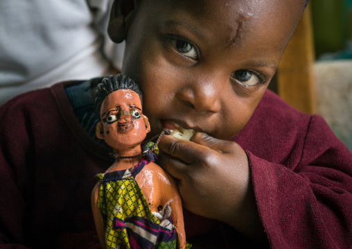 Benin, West Africa, Ouidah, paterne with the carved wooden figure made to house the soul of his dead twin paterna