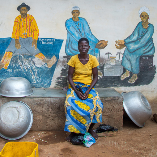 Benin, West Africa, Savalou, a priestess from the voodoo covent of the royal palace in front of a painted wall