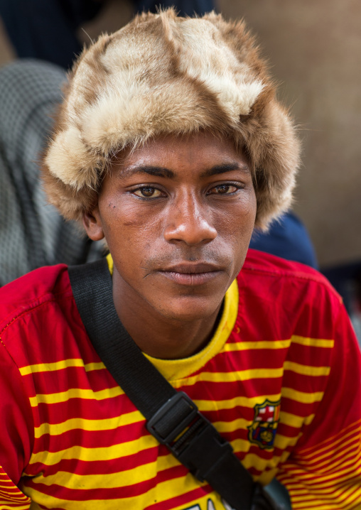 Benin, West Africa, Copargo, young fulani peul tribe man with colorful and fashionable clothes