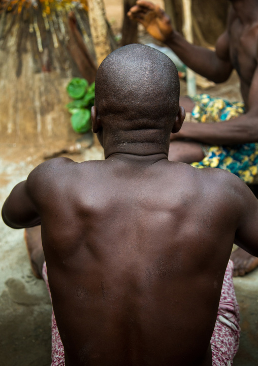 Benin, West Africa, Bopa, drummer back during a voodoo ceremony