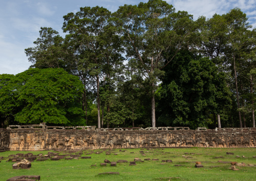 Relief carving with men on elephants at Angkor thom temple, Siem Reap Province, Angkor, Cambodia