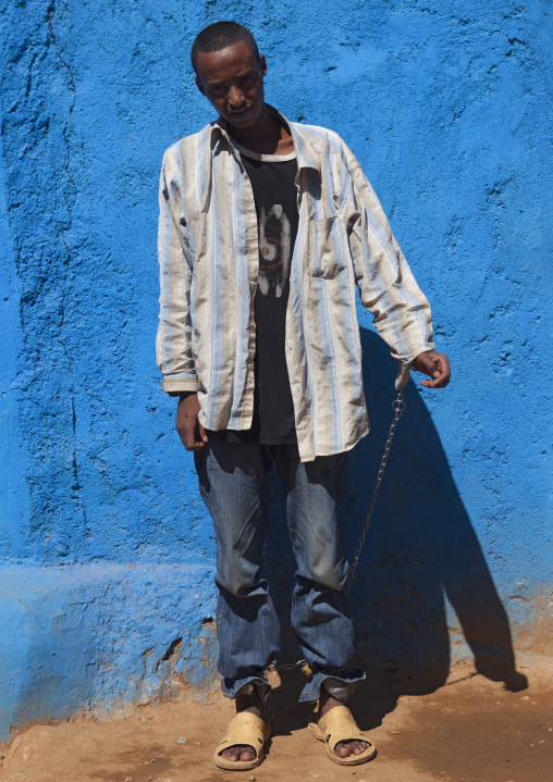 Portrait Of A Man Chained By His Parents After Becoming Mad Due To An Overdose Of Qat, Harar, Ethiopia