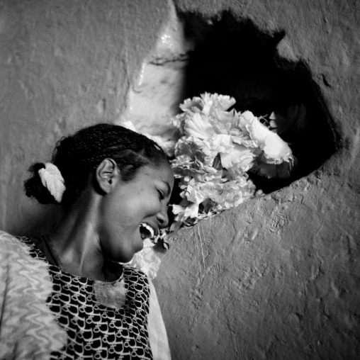Black And White Portrait Of A Smiling Girl In An Harari Old House With A Niche In The Wall, Harar, Ehtiopia