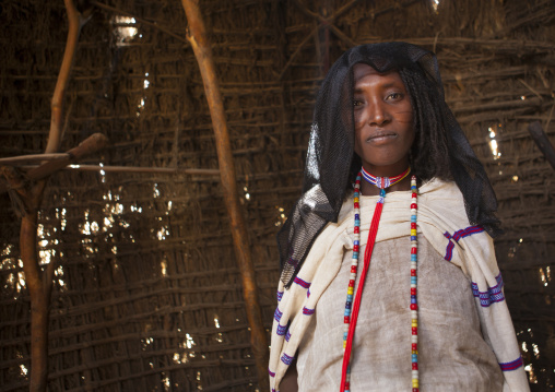 Karrayyu Tribe Woman With Stranded Hair, A Black Headscarf And Colourful Necklaces In A House At Gadaaa Ceremony, Metehara, Ethiopia