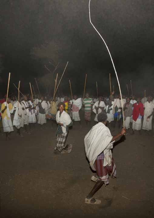 Night Shot Of Two Karrayyu Tribe Men During A Choreographed Stick Dance At Gadaaa Ceremony, Metahara, Ethiopia