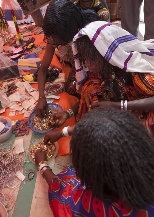 Karrayyu Tribe Women Choosing Rings For A Wedding In Karrayyu Tribe, Metehara Market, Ethiopia