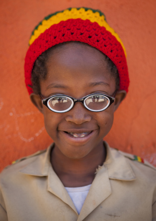 Rasta Kid With Thick Glasses And Rasta Hat In Shashemene Jamaican School, Oromia Region, Ethiopia