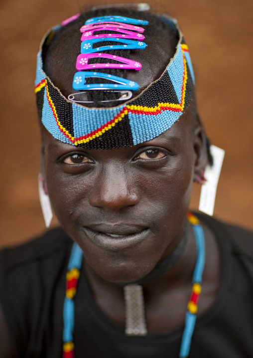 Fashionable tsemay tribe man posing in key afer, Omo valley, Ethiopia
