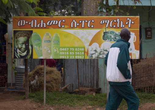 A Man Passing By An Ad Billboard Omo Valley Ethiopia