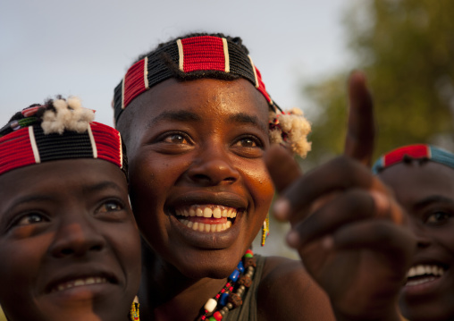Smiling Bana Two Young Women With Beaded Headband Jumping Ceremony Ethiopia