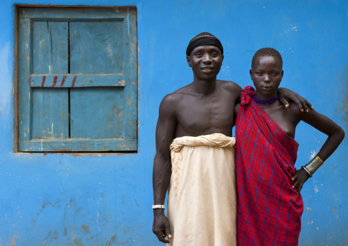Bodi Couple Man And Woman Posing With  Loincloth Outside Blue House Ethiopia