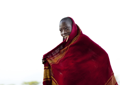 Bodi Teenage Boy Chewing Siwak Stick In Red Loincloth Ethiopia