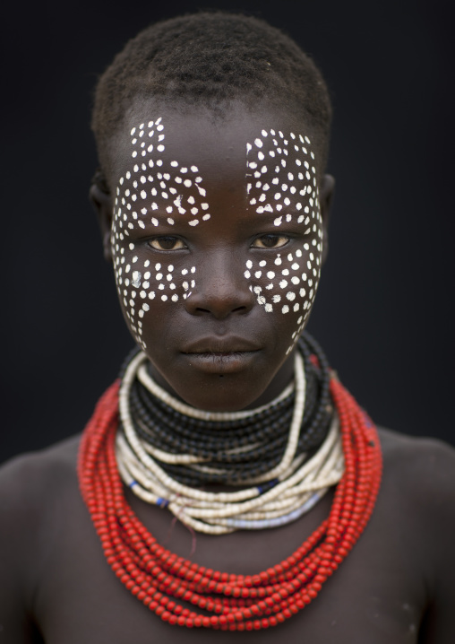 Portrait Of Beautiful Dark Eyed Karo Woman With White Dots Painted On Face Wearing Beaded Necklace Ethiopia