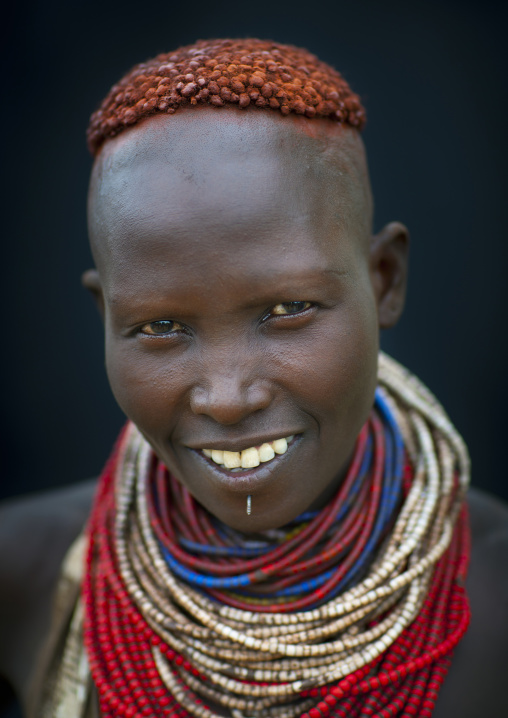 Portrait Of Beautiful Dark Eyed Karo Woman Wearing Beaded Necklace Ethiopia