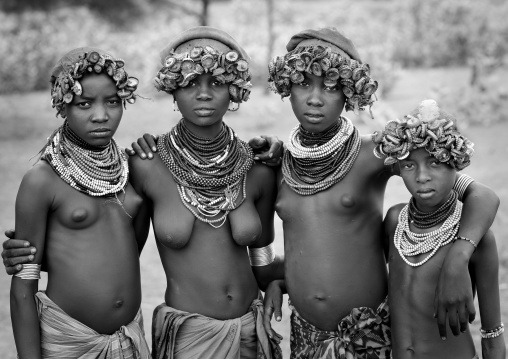 Group Of Dassanech Teenagers Posing, Wear Headgear Made Of Bottle Caps Omorate Ethiopia