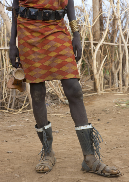 Inferior Members Of Dassanech Man Carrying Headrest In Hand Omorate Ethiopia