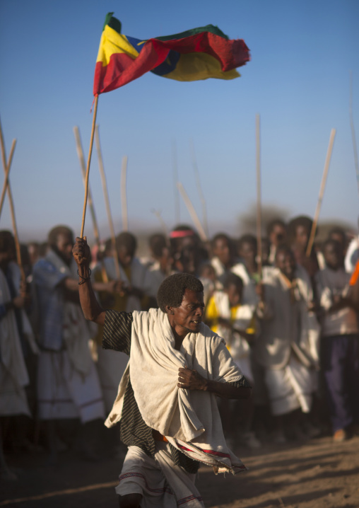 Karrayyu Tribe Man Carrying The Ethiopian Flag During Stick Fighting Dance, Gadaaa Ceremony, Metahara, Ethiopia