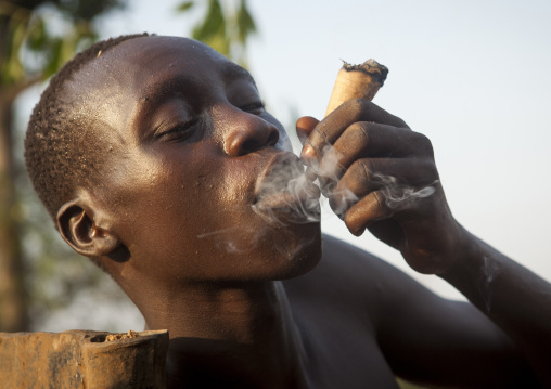 Majang Tribe Man Smoking For A Celebration, Kobown, Ethiopia