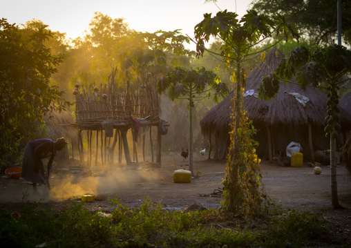 Anuak Tribe Woman Cleaning The Ground In Abobo, The Former Anuak King Village, Gambela Region, Ethiopia