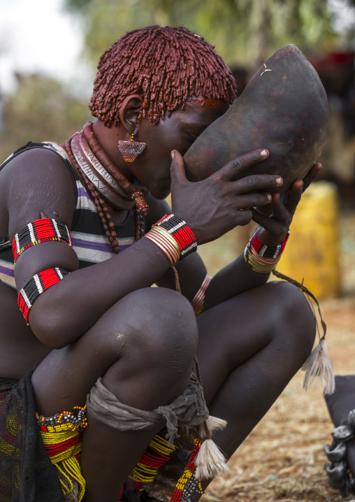 Bashada Tribe Woman Drinkinf Alcohol During A Bull Jumping Ceremony, Dimeka, Omo Valley, Ethiopia