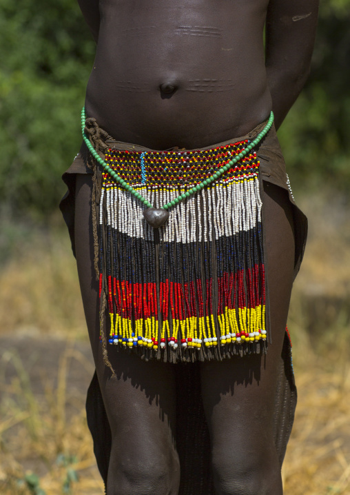 Portrait Of A Nyangatom Tribe Girl With Traditional Beaded Skirt, Omo Valley, Kangate, Ethiopia